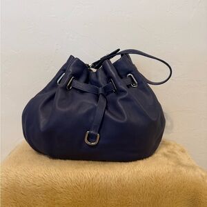 Cole Haan- Deep Royal 
Blue Leather Drawstring Shoulder Bag